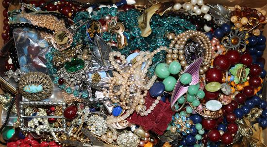 Assorted costume jewellery including necklaces.